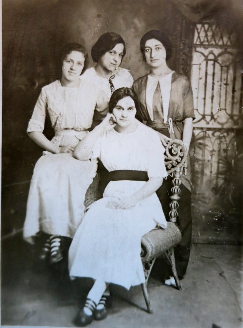 With friends, Maude, (upper middle), with a little mischief in her eyes